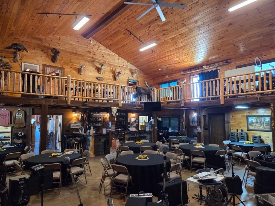 Event setup with round tables and sunflower centerpieces
